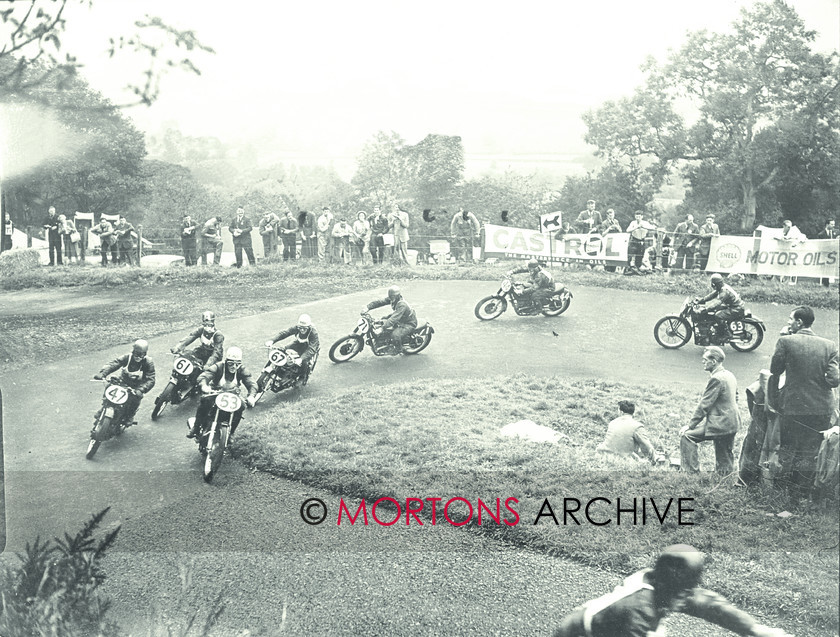 062 SFTP C25668 
 Bill Doran (AJS, 53) heads a field of 350cc runner. Others include Les Archer (Velocette, 61), Geoff Duke (Norton, 67), Syd Barnett (AJS, 71) and Dickie Dale (Velo, 63). 
 Keywords: 1949, May, Mortons Archive, Mortons Media Group, Oliver's Mount, Scarborough, Straight from the plate, The Classic MotorCycle