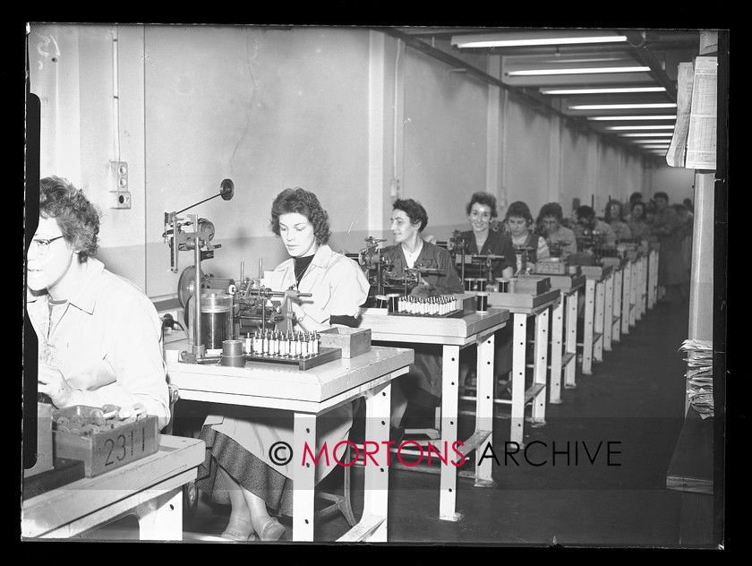 19674-15 
 Villiers engineering, Wolverhampton. Scooter engine production, coil winding. 
 Keywords: 1959, 19674-15, August 2009, coil winding, engine, glass plate, Mortons Archive, Mortons Media, Mortons Media Group Ltd., production, scooter, scooter engine production, Straight from the plate, The Classic MotorCycle, villiers, villiers engineering, wolverhampton