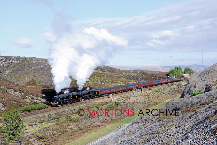 048 44871 Slochd 
 After stopping to cross the Euston sleeper and to allow the HST to King's Cross to overtake, 'Black Fives' Nos 44871 and 45407 depart from Slochd summit on the Highland main line on May 13. 
 Keywords: 2014, Heritage Railway, Issue 190, Mortons Archive, Mortons Media Group Ltd