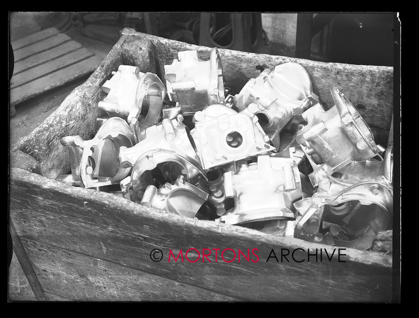 19674-04 
 Villiers engineering, Wolverhampton. Scooter engine production, gearbox castings. 
 Keywords: 1959, 19674-04, August 2009, engine, gearbox castings, glass plate, Mortons Archive, Mortons Media, Mortons Media Group Ltd., production, scooter, scooter engine production, Straight from the plate, The Classic MotorCycle, villiers, villiers engineering, wolverhampton