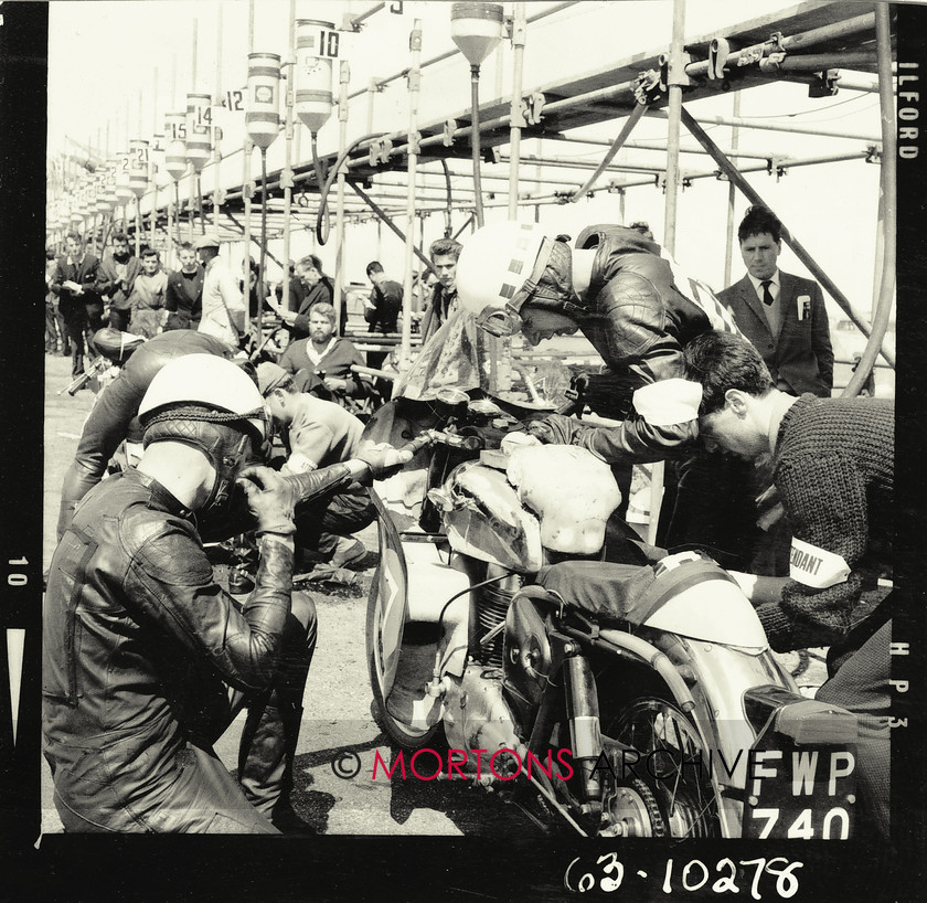 062 glass plate 06 
 The Royal Enfield 350cc Super 5 Sportsflow ridden by John Hartle and Monty Buxton pits for a quick refuel before going in the 250cc class. 
 Keywords: 1963, 2013, Glass plate, June, Mortons Archive, Mortons Media Group, Straight from the plate, The Classic MotorCycle, Thruxton 500 mile race