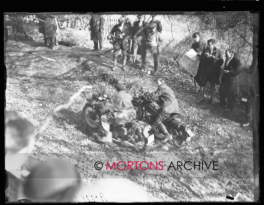 062 SFTP A9117 
 Who's going past who? It would seem that its C P D Read on the right aboard his Rudge, who's stuck in the mud. 
 Keywords: 1928, 2012, Mortons Archive, Mortons Media Group, September, Southern Trial, Straight from the plate, The Classic MotorCycle