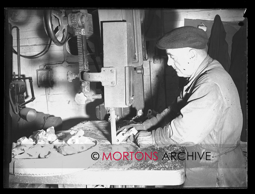 19674-03 
 Villiers engineering, Wolverhampton. Cleaning off extraneous metal in the foundry. 
 Keywords: 1959, 19674-03, August 2009, cleaning off, engine, extranoeus metal, glass plate, Mortons Archive, Mortons Media, Mortons Media Group Ltd., production, scooter, scooter engine production, Straight from the plate, The Classic MotorCycle, villiers, villiers engineering, wolverhampton