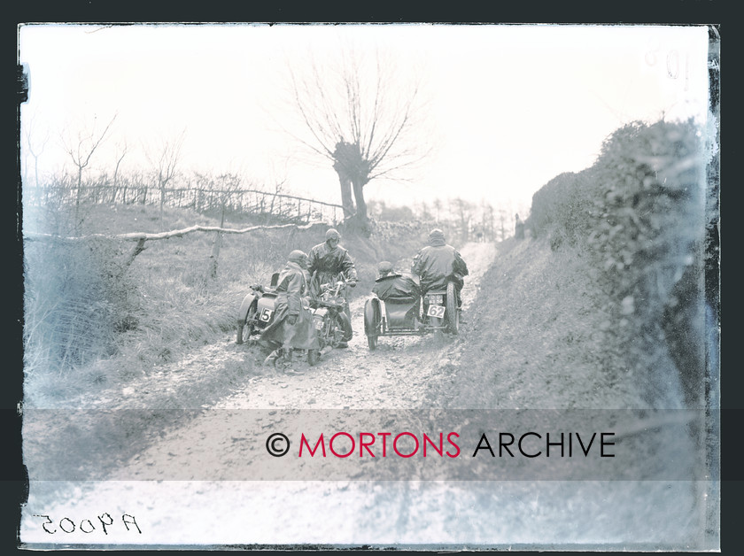 CARDIFF-LEICESTER 1928 06 
 V C O Anstice (596cc Douglas sc) scraping by N B Mitchell (349cc Humber sc) on Bushcombe. 
 Keywords: 1928 Cardiff - Leicester - Cardiff trial, 2011, Mortons Archive, Mortons Media Group, November, Straight from the plate, The Classic MotorCycle