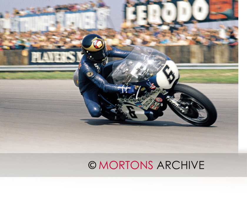 B 009 
 Cockney Rebel - Barry Sheene - Trying hard on the 'water buffalo' TR750 Suzuki, Silverstone, 1973. 
 Keywords: 2012, Barry Sheene, Bookazine, Classic British Legends, Mortons Archive, Mortons Media Group