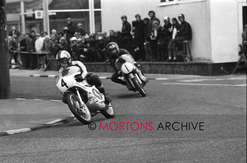 100 - Nick Nicholls Archive - Barry Sheene No1 Suzuki - C Mortemer No4 Yamaha 1971 125cc TT 
 29b3 1971 125cc TT - No. 4 Charles Mortimer (Yamaha) leading No. 1 Barry Sheene (Suzuki) going trough Ramsey 
 Keywords: 2015, Island Racer, Isle of Man, Mortons Archive, Mortons Media Group Ltd, Nick Nicholls, TT