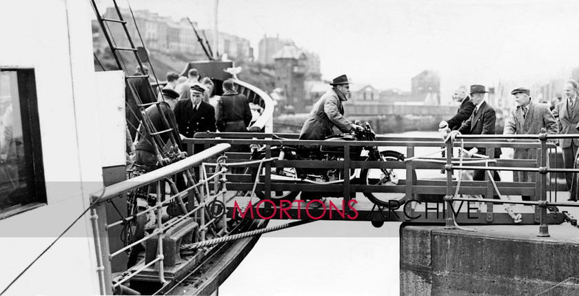 Manx 10E 
 11E– It’s a precarious landing for one 1949 TT competitor. 
 Keywords: 2012, Exhibition of historic images, Manx Grand Prix, Mortons Archive, Mortons Media Group, Mountain Milestones - Memories from Mona's Isle