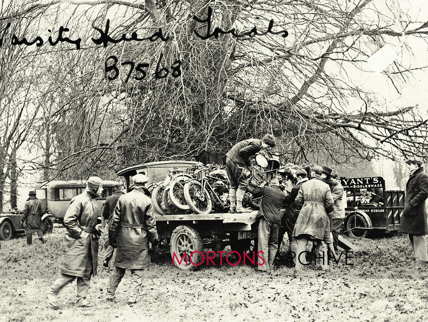 064 Glass Plate 06 
 Varsity Velocity February 1932 - Many hands make light work... 'unloading' the old fashioned way. Note the Bryant's of Biggleswade trailer in the background - in the 1970s, Charlie Sanby successfully raced the Bryant's backed Moto Guzzi, while the business lasted until 1992. 
 Keywords: 2013, Glass plate, January, Mortons Archive, Mortons Media Group, Straight from the plate, The Classic MotorCycle