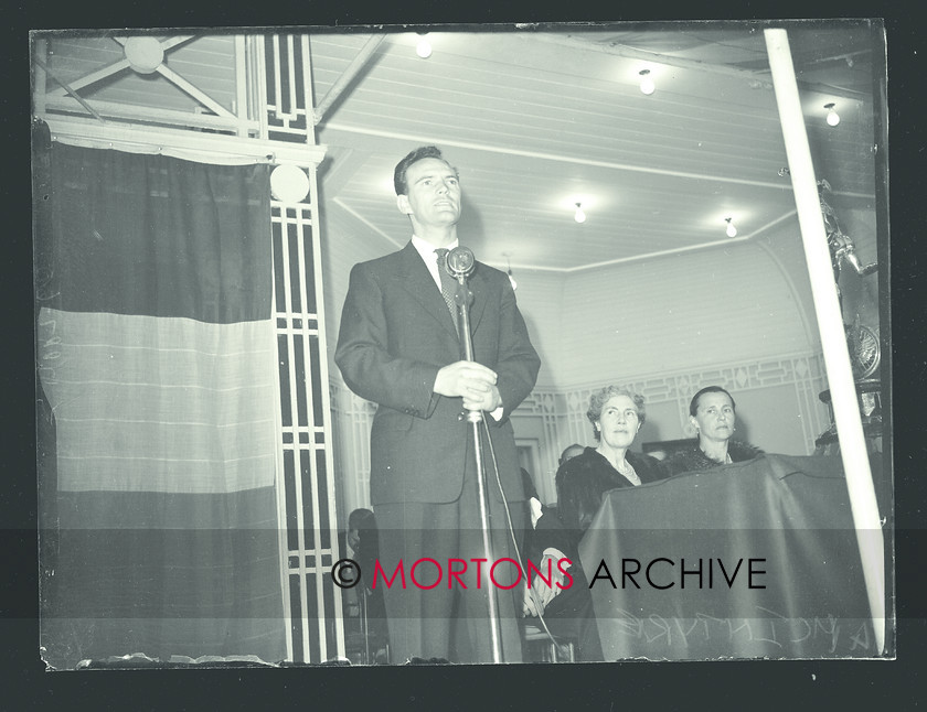 053 SFTP SENIOR TT 1957 02 
 A golden day at the Senior TT, 1957 - Bob McIntyre at the presentation ceremony. 
 Keywords: 1957, Glass plate, Isle of Man, Mortons Archive, Mortons Media Group Ltd, Straight from the plate, The Classic MotorCycle, TT