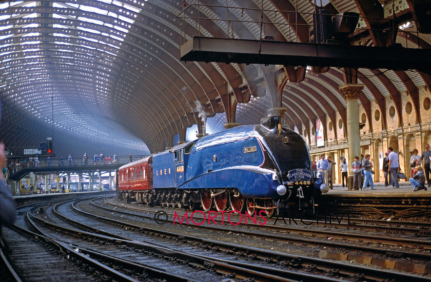 Roofs 003 
 Left: The present York station, designed by NER architects Thomas Prosser and William Peachey, was opened in 1877. It had 13 platforms and was at that time the largest station in the world. LNER A4 Pacific 4468 Mallard stands awaiting departure for Scarborough on April 26, 1987. The centre roads were removed during electrification work in 1988. BRIAN SHARPE