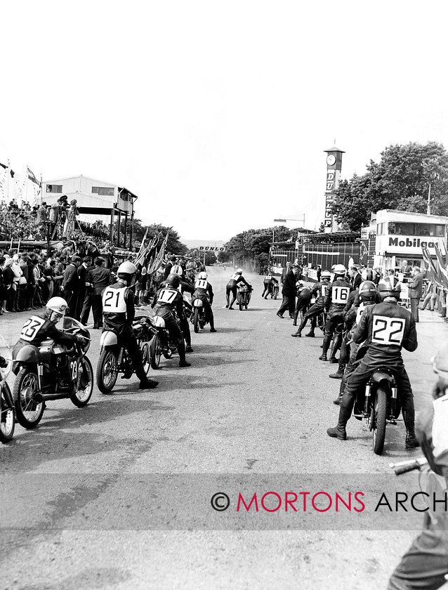 Manx Page 4 
 How many can you name? Number 5 is Luigi Taveri, Honda, 7 Mike Hailwood, Honda, who went on to win, 11, Tommy Robb, Bultaco, 16, Dan Shorey, 17, Rex Avery, EMC, 21, Johnny Grace, 22, Phil Read, Bultaco, and 23, Gary Dickinson, Ducati. 
 Keywords: 2012, Exhibition of historic images, Manx Grand Prix, Mortons Archive, Mortons Media Group, Mountain Milestones - Memories from Mona's Isle