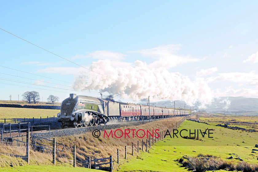 60009 Salterwath 
 A4 conquers the fells - LNER A4 Pacific No. 60009 Union of South Africa is master of the job of taking 12 coaches up the 1-in-80 to Shap summit with the Railway TOuring Company's Winter Cumbrian Mountain Express' from Euston on February 2nd. 
 Keywords: Heritage Railway, Mortons Archive, Mortons Media Group, News