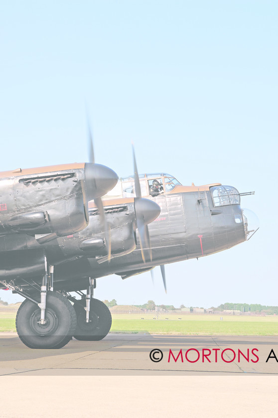 WD523891@26 Flying 10 
 With all four engines running and checks complete. FltLt.Rushmere checks that everything is clear before the Lancaster begins to taxi. 
 Keywords: (Multiple values), Aviation Classics, date ?, event ?, feature Flying, issue 1, make Avro, model Lancaster, Mortons Archive, Mortons Media Group, person(s) name ?, place ?, publication Aviation, type BI, year 1945