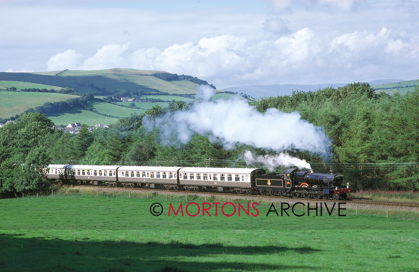 WD594788@64 preservation 00 
 On a Machynlleth - Aberystwyth working, Severn Valley-based WR 4-6-0 No 7819 Hinton Manor passes Bow Street on the Cambrain Coast Line on 2nd August 1987. 
 Keywords: Heritage Railway, Mortons Archive, Mortons Media Group