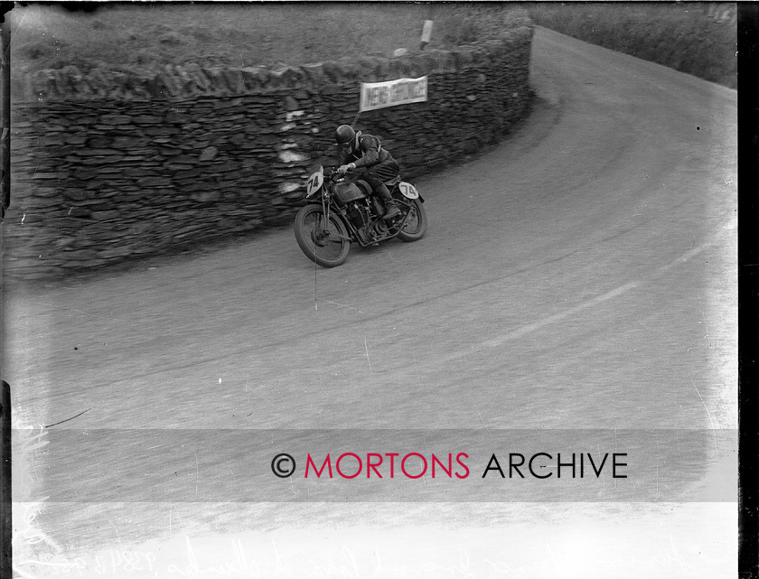 9384-01 
 1936 Junior and Lightweight Manx Grands Prix. Junior winner Austin Munks, all tucked in and looking stylish, aboard his KTT Velo. 
 Keywords: 1936, 9384-01, a munks, glass plate, isle of mann, January 2010, manx, manx junior grand prix, Mortons Archive, Mortons Media, Mortons Media Group Ltd., signpost corner, The Classic MotorCycle, tt, velocette