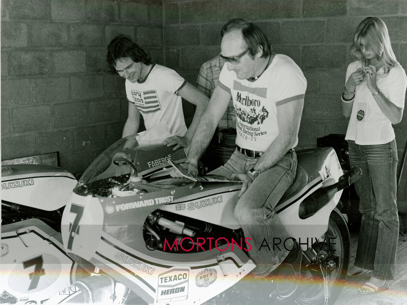 Hailwood and Sheene 0001 
 Mike Hailwood sitting on the Brut Faberge Suzuki with Bary Sheene looking on and Stephanie Sheene in the background 
 Keywords: Barry Sheene, Mike Hailwood, Mortons Archive, Mortons Media Group Ltd