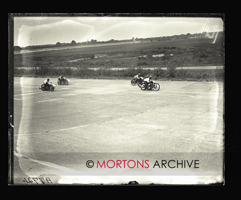 062 SFTP 18 
 Thrills, spills and new world records Brooklands, 1927. Riders pressing on in the 350cc race, in this unusual view. 
 Keywords: 2014, Glass plates, July, Mortons Archive, Mortons Media Group Ltd, Straight from the plate, The Classic MotorCycle