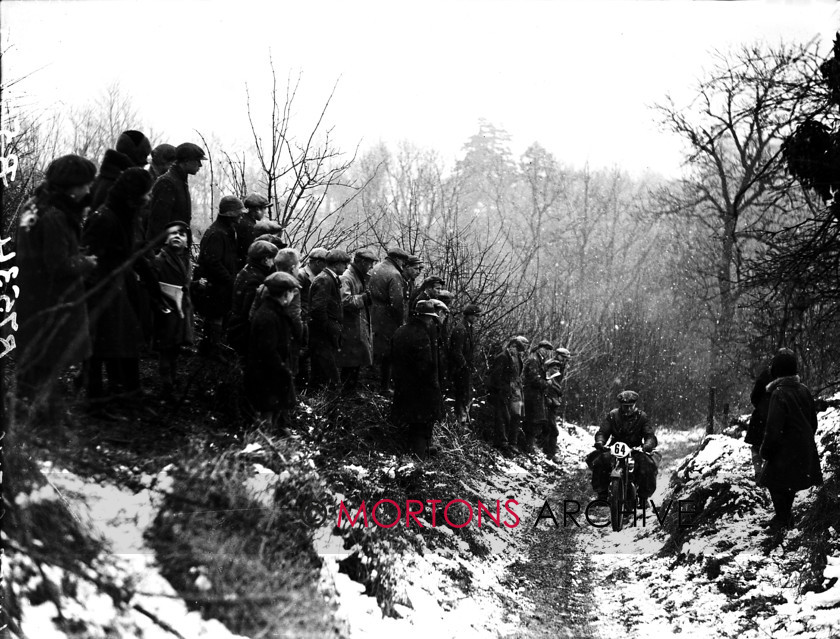 051 SFTP - 04 
 1932 Colmore Cup Trial - W Brandish is watched keenly by a cluster of spectators the Lower Guiting. 
 Keywords: 2015, Mortons Archive, Mortons Media Group Ltd, October, Straight from the plate, The Classic MotorCycle, Trials