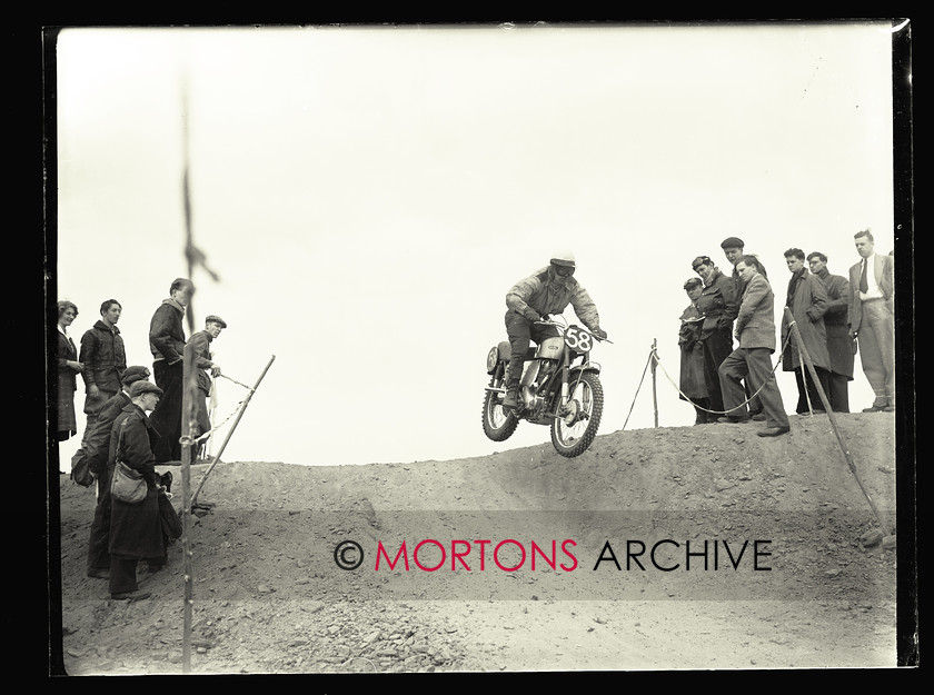 062 SFTP 05 
 Sunbeam point-to-point, April 1953 - Leaping through the air is Frank Bentham, on the works Ariel. Earles forks clearly evident. 
 Keywords: 2013, Glass plate, Mortons Archive, Mortons Media Group, October, Point to point, Straight from the plate, Sunbeam, The Classic MotorCycle